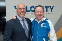 two men smiling for the camera